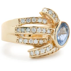 14 Karat Yellow Gold Bezel Set Cornflower Blue Sapphire and Diamond Bypass Ring