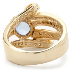 14 Karat Yellow Gold Bezel Set Cornflower Blue Sapphire and Diamond Bypass Ring