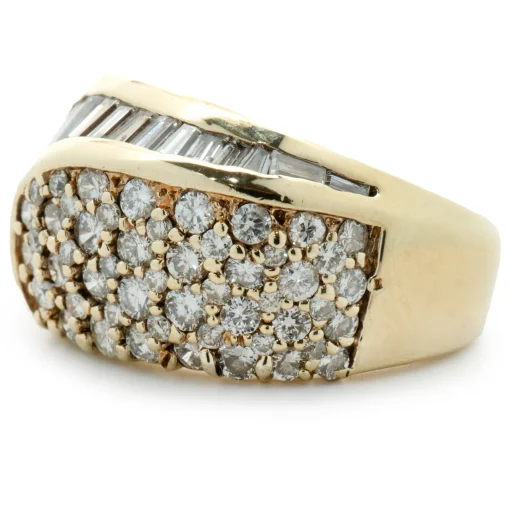 14 Karat Yellow Gold Round and Baguette Cut Diamond Swirl Ring